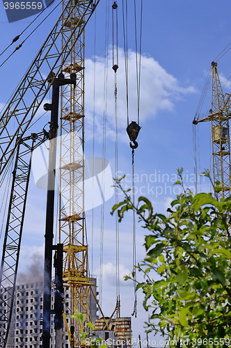 Image of Mechanism scores piles at construction site