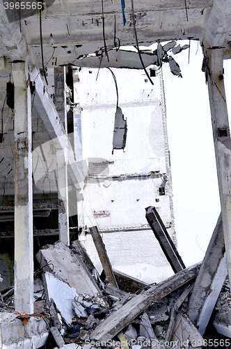 Image of Pieces of Metal and Stone are Crumbling from Demolished Building