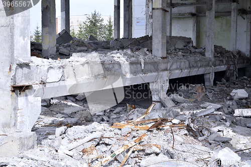 Image of Pieces of Metal and Stone are Crumbling from Demolished Building