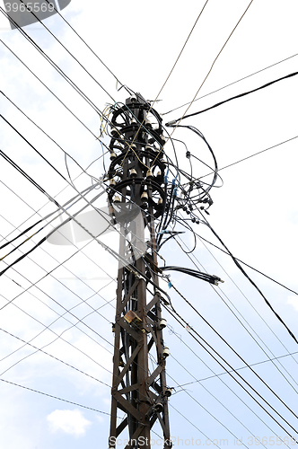 Image of Many wires on an old electric pole