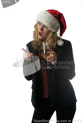 Image of Shocked woman in Santa hat holding glass of wine