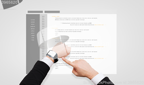 Image of businessman hands with coding on smart watch