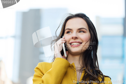 Image of smiling young woman or girl calling on smartphone