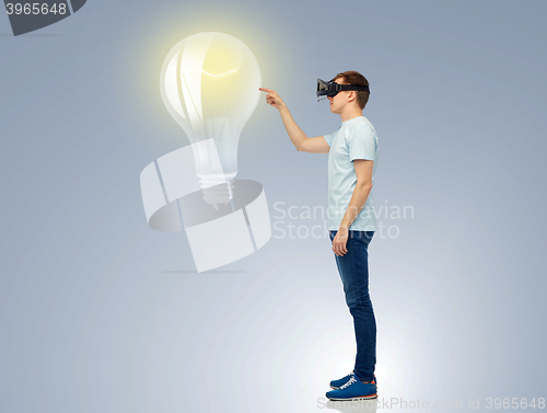 Image of happy man in virtual reality headset or 3d glasses