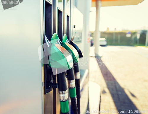 Image of close up of gasoline hose at gas station