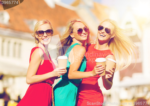 Image of women with takeaway coffee cups in the city