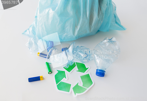 Image of close up of used bottles and batteries recycling