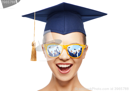 Image of happy teenage girl in shades and mortarboard hat