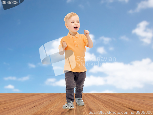 Image of happy little boy in casual clothes