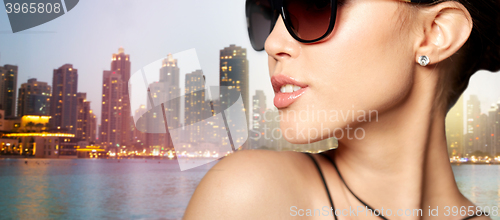 Image of close up of beautiful woman in black sunglasses