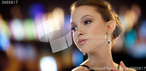 Image of beautiful young asian woman with earring