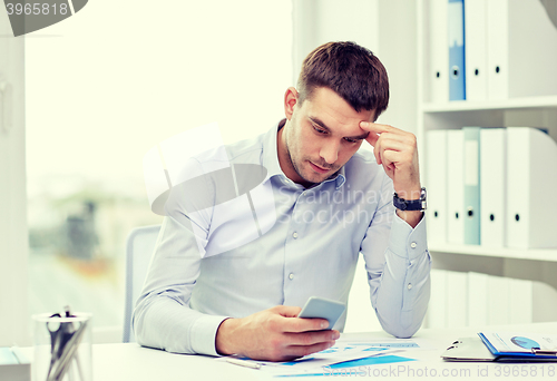 Image of close up of businessman with smartphone