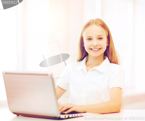 Image of girl with laptop pc at school