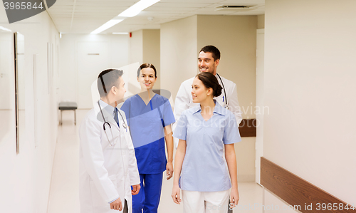 Image of group of happy medics or doctors at hospital