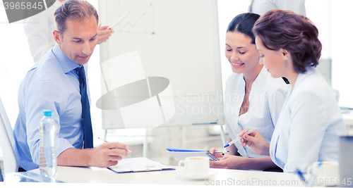 Image of business team discussing something in office