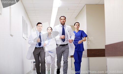 Image of group of medics walking along hospital