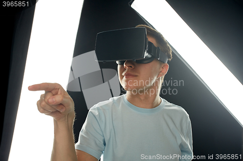 Image of happy man in virtual reality headset or 3d glasses