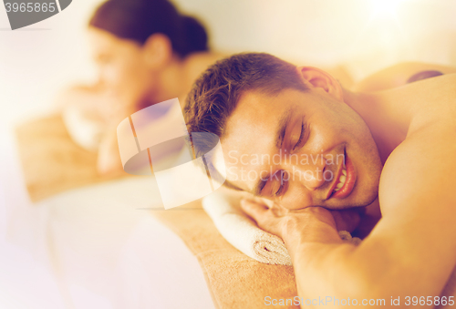 Image of couple in spa with hot stones