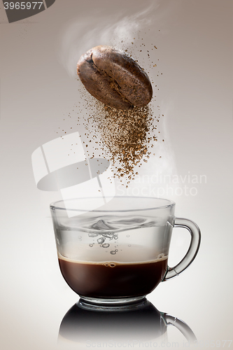 Image of pours instant coffee in a cup