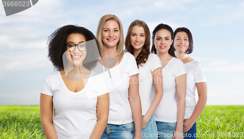 Image of group of happy different women in white t-shirts