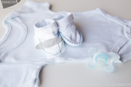 Image of close up of baby boys clothes for newborn on table