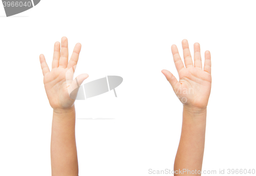 Image of close up of little child hands raised upwards