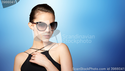 Image of beautiful young woman in elegant black sunglasses