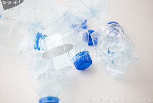 Image of close up of empty used plastic bottles on table