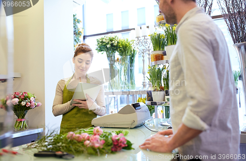 Image of florist woman and man making order at flower shop