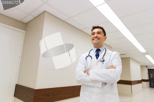 Image of smiling doctor in white coat at hospital