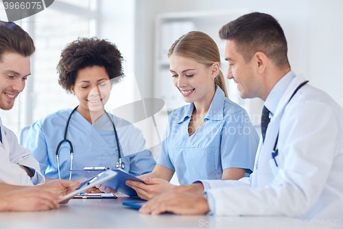 Image of group of happy doctors meeting at hospital office