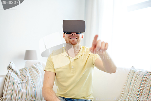 Image of young man in virtual reality headset or 3d glasses