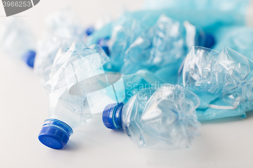 Image of close up of used plastic bottles and rubbish bag