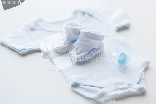 Image of close up of baby boys clothes for newborn on table