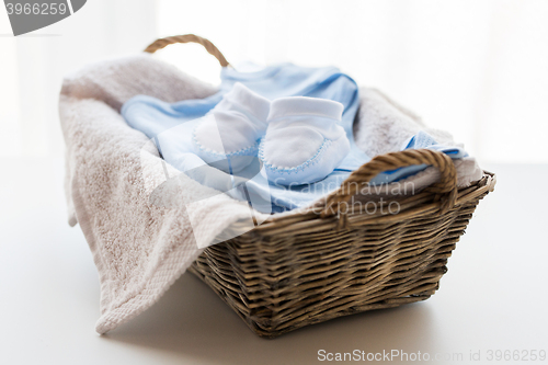 Image of close up of baby clothes for newborn boy in basket