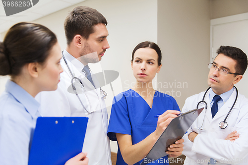 Image of group of medics with clipboards at hospital