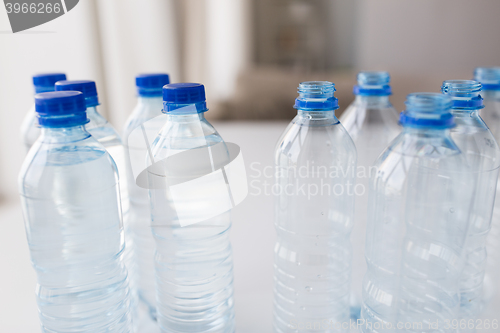 Image of close up of bottles with drinking water on table