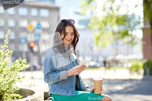 Image of happy young woman or teenage girl with smartphone