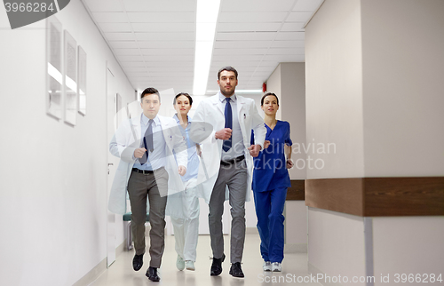 Image of group of medics walking along hospital