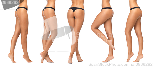 Image of female legs and bottom in black bikini panties