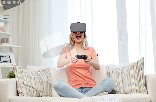 Image of woman in virtual reality headset with controller