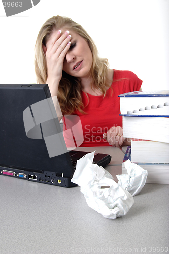 Image of Woman holding head