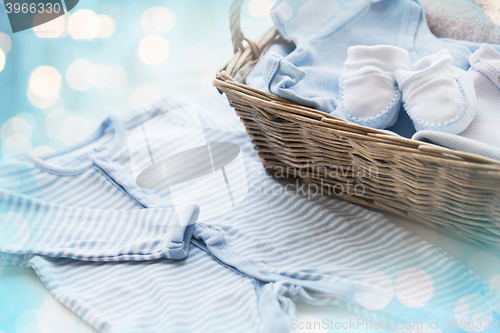 Image of close up of baby clothes for newborn boy in basket