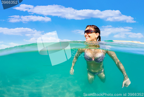 Image of pretty woman swim in red sea