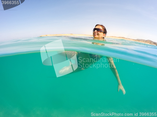 Image of pretty woman swim in red sea