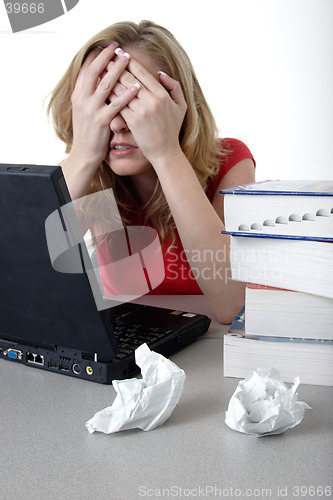 Image of Frustrated woman working on computer