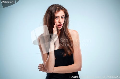 Image of The young woman telling a secret