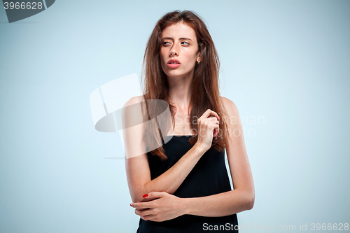 Image of The thoughtful woman on gray background