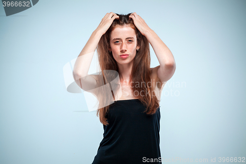 Image of The thoughtful woman on gray background