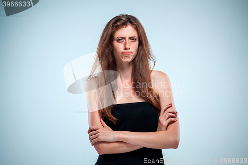 Image of The disgusted and frowning young woman